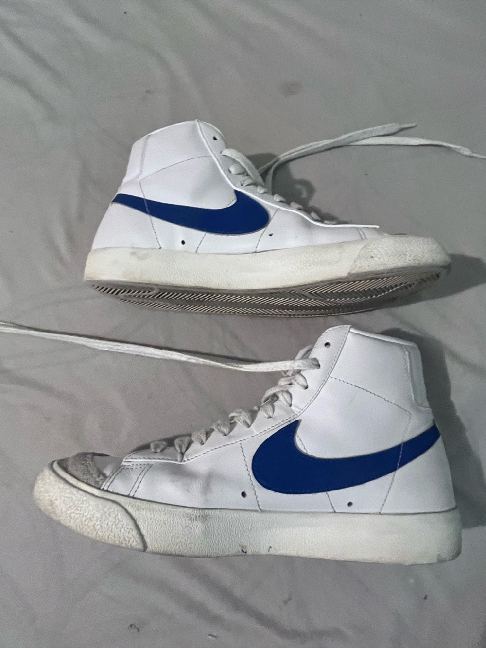 Nike White High-Top Sneakers with Blue Swoosh Accent